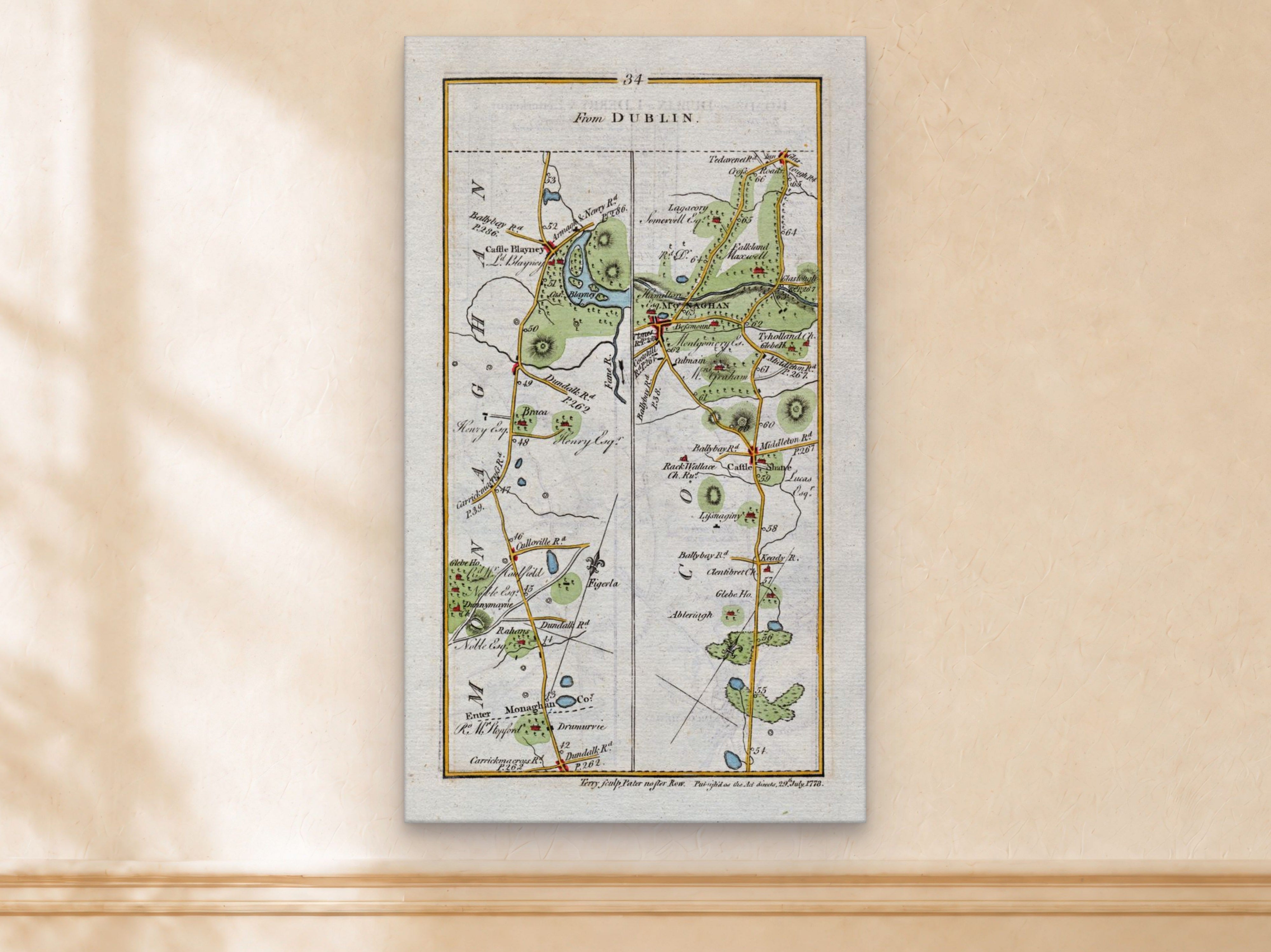 1783 Taylor & Skinner Castleblayney, Monaghan, Castleshane, Tyholland and Clontibret Ireland road map displayed on a light cream wall.