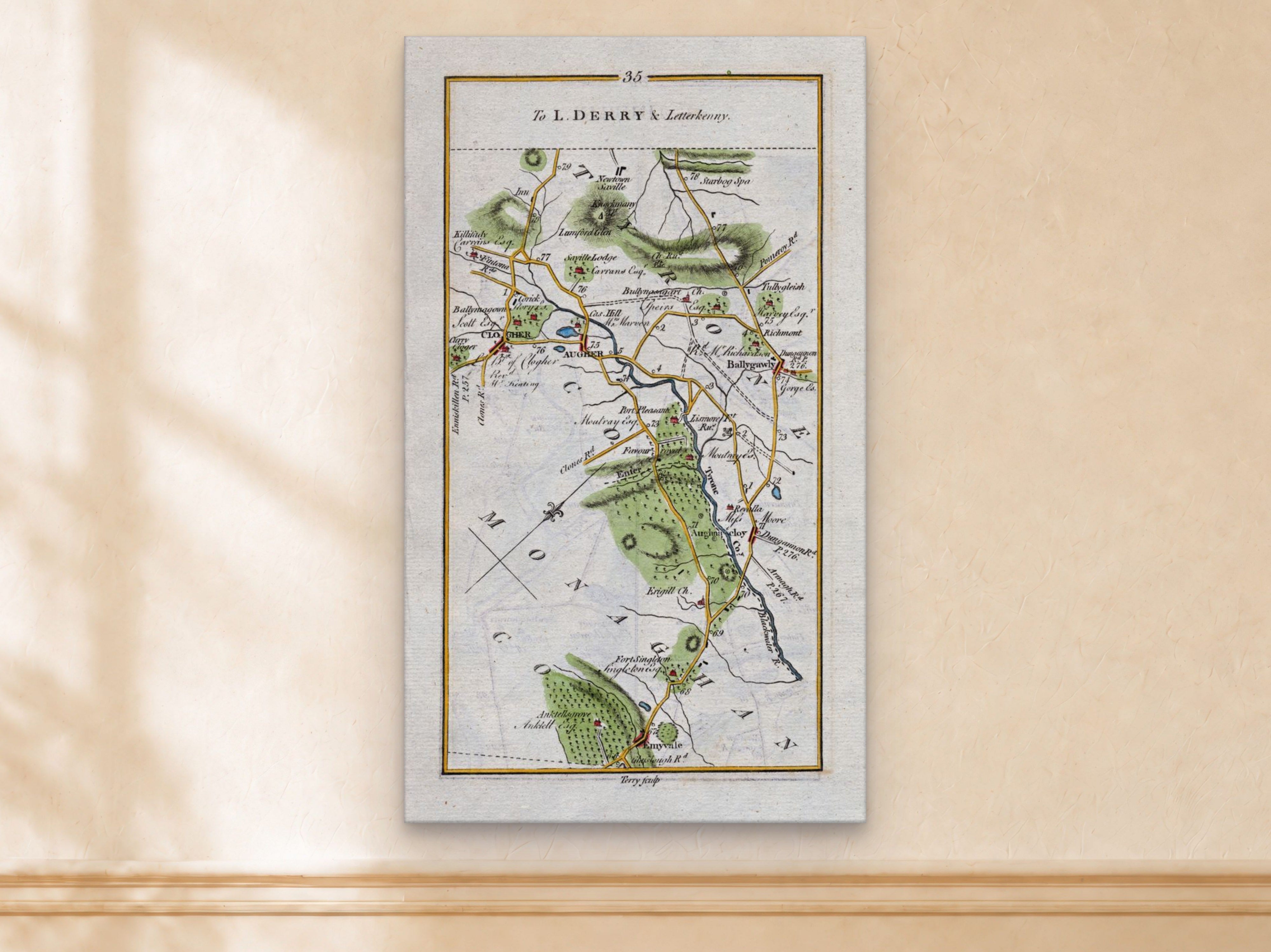1783 Taylor & Skinner Clogher, Augher, Ballygawley and Aughnacloy, Tyrone Ireland road map displayed on a light cream wall.