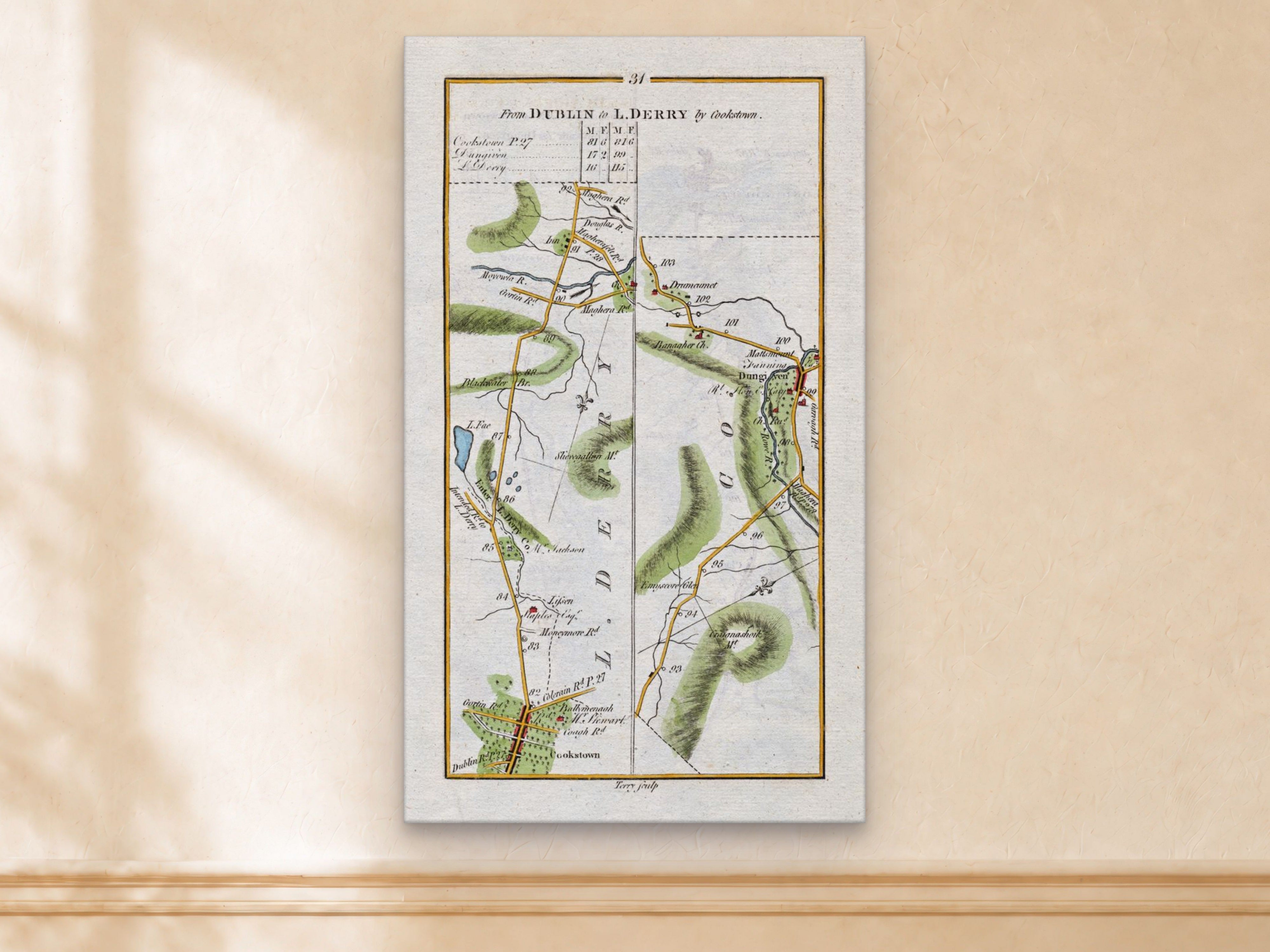 1783 Taylor & Skinner Cookstown, Dungiven, Lissan, Banagher and Londonderry Ireland road map displayed on a light cream wall.