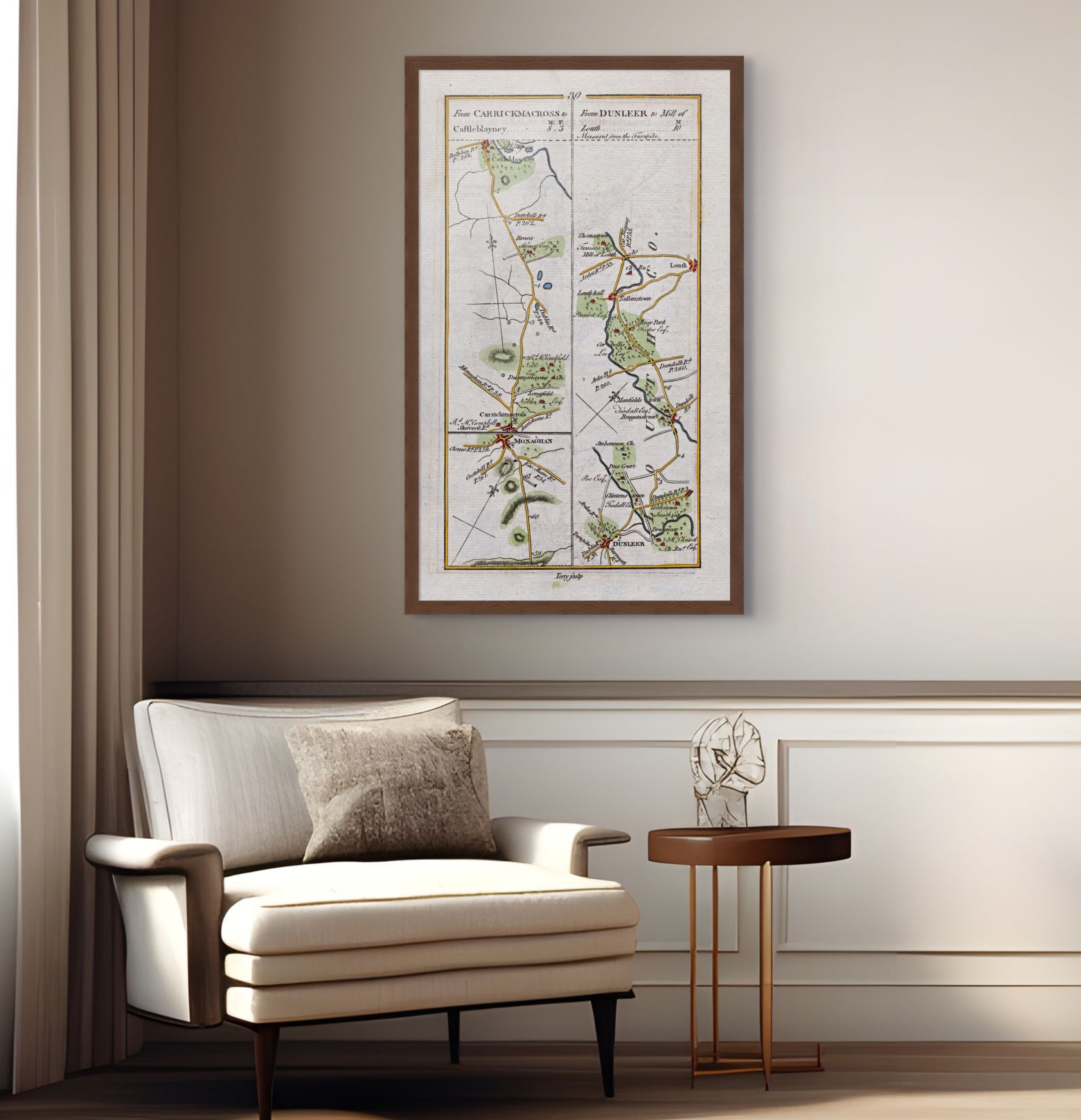 1783 Taylor & Skinner Carrickmacross, Castleblayney, Dunleer, Louth and Monaghan Ireland road map displayed above an armchair in a neutral interior. The map covers Counties Louth and Monaghan.