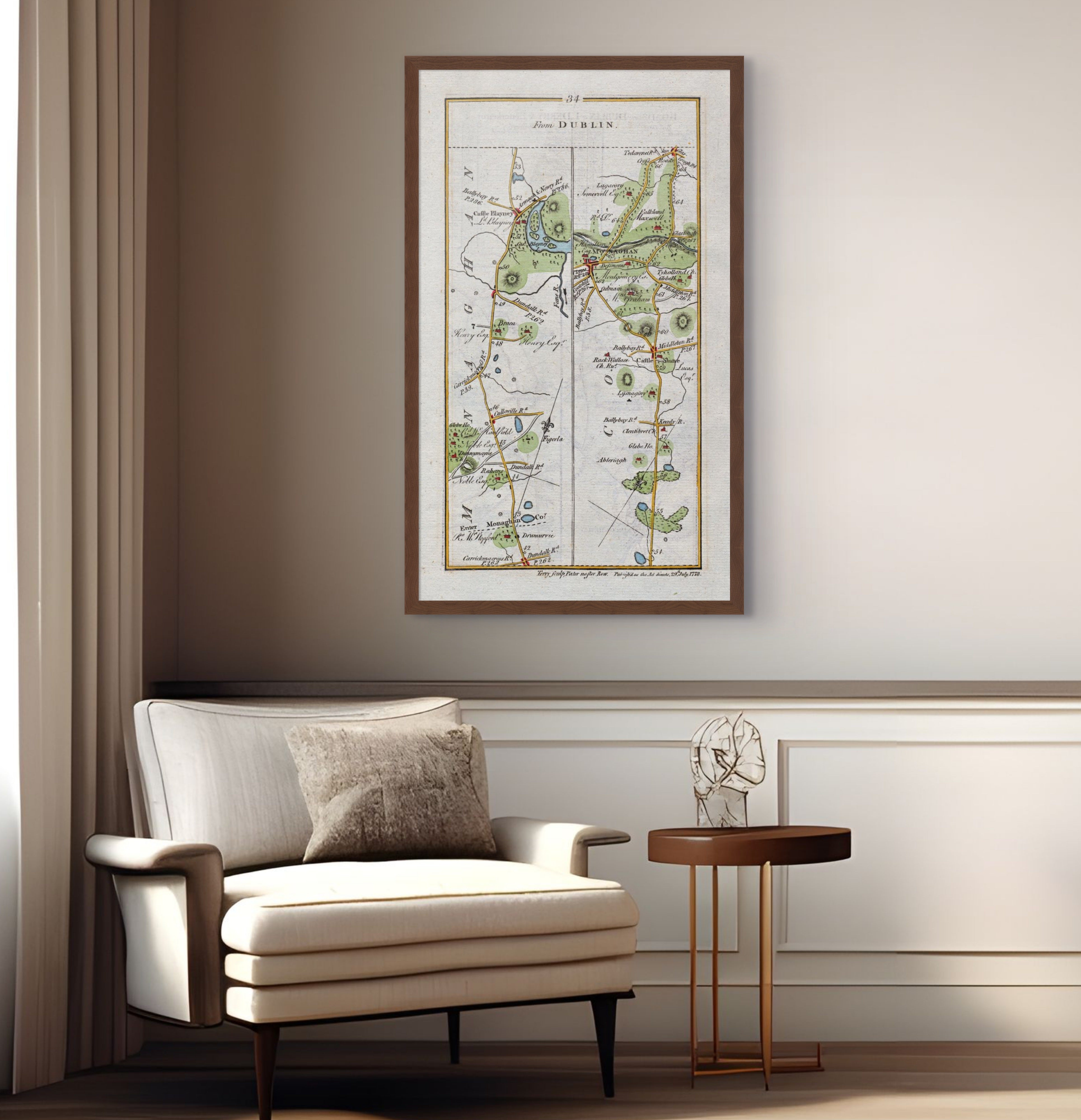 1783 Taylor & Skinner Castleblayney, Monaghan, Castleshane, Tyholland and Clontibret Ireland road map displayed above an armchair in a neutral interior.