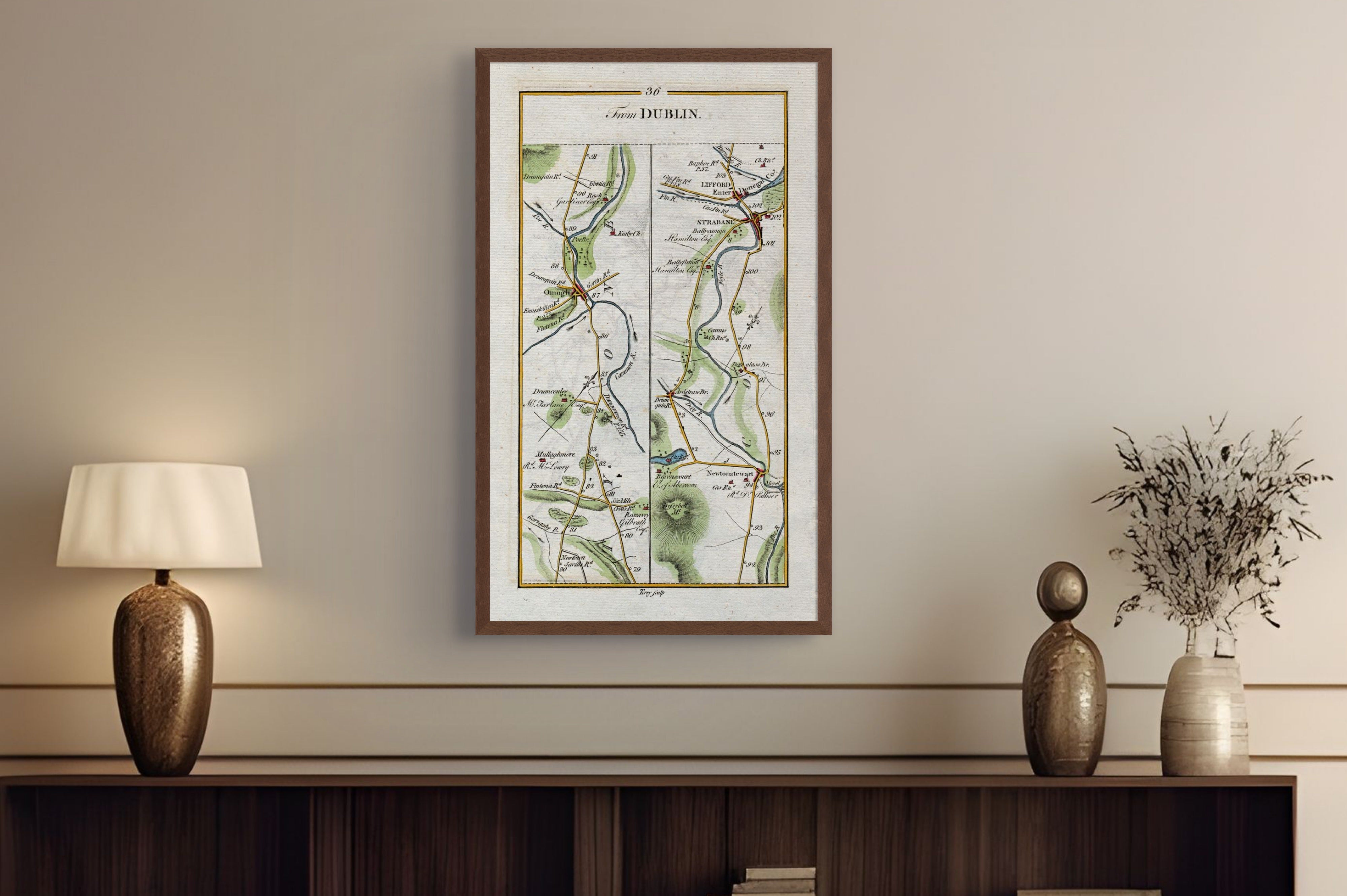 1783 Taylor & Skinner Strabane, Lifford, Omagh and Newtownstewart Ireland road map displayed above a console table. The map covers Counties Tyrone and Donegal.