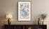 Framed antique Ireland road map of Antrim, Randalstown, Kells, Connor and Grange displayed in a styled room interior.