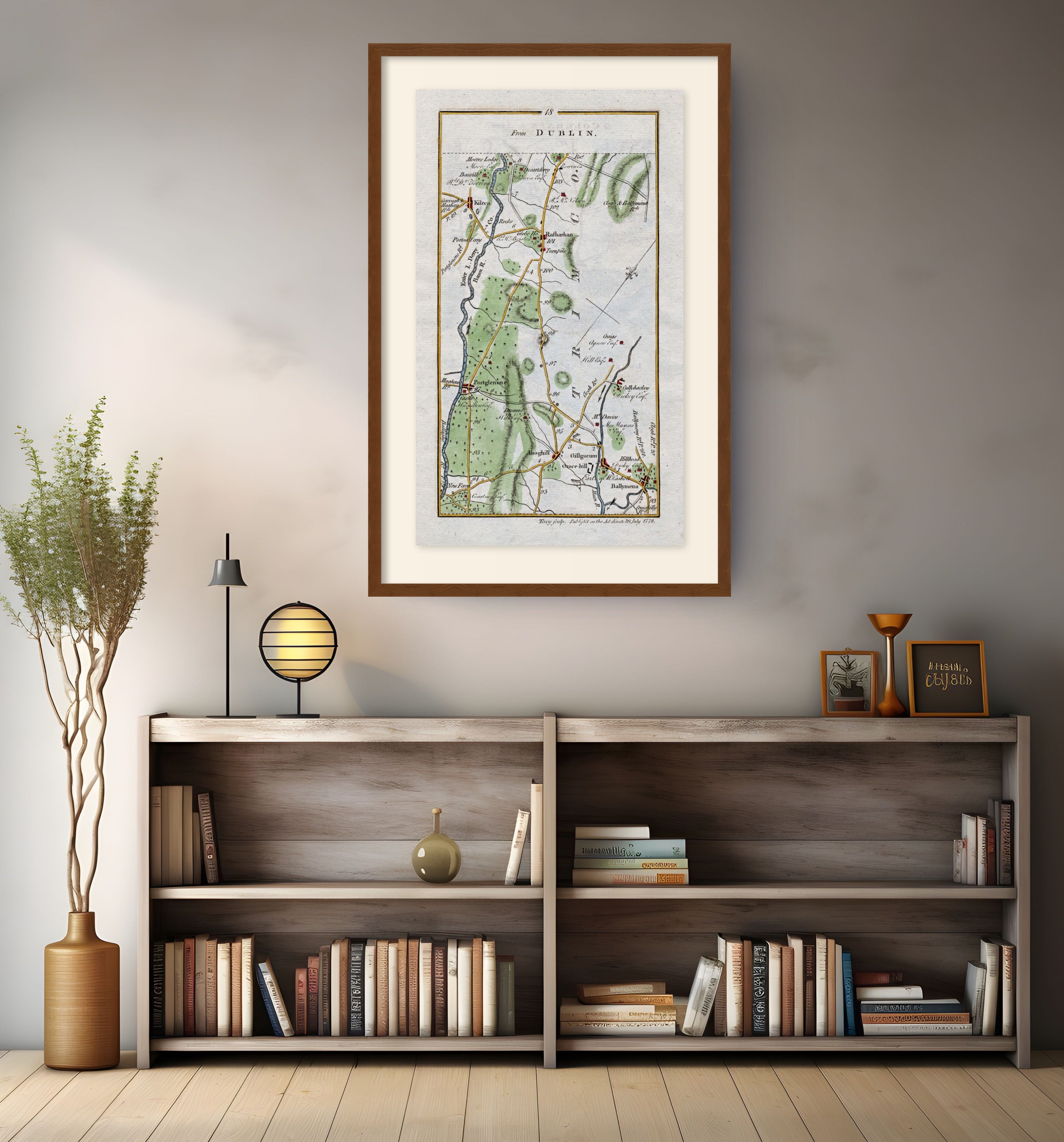 Framed antique Ireland road map of Ballymena, Portglenone, Kilrea and Cullybackey displayed in a modern interior.