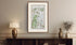 Framed antique Ireland road map of Ballymena, Portglenone, Kilrea and Cullybackey displayed in a styled room interior.