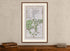 Framed 1783 Taylor & Skinner Banbridge, Gilford, Waringstown and Loughbrickland, Ireland road map displayed above an antique wooden cabinet.