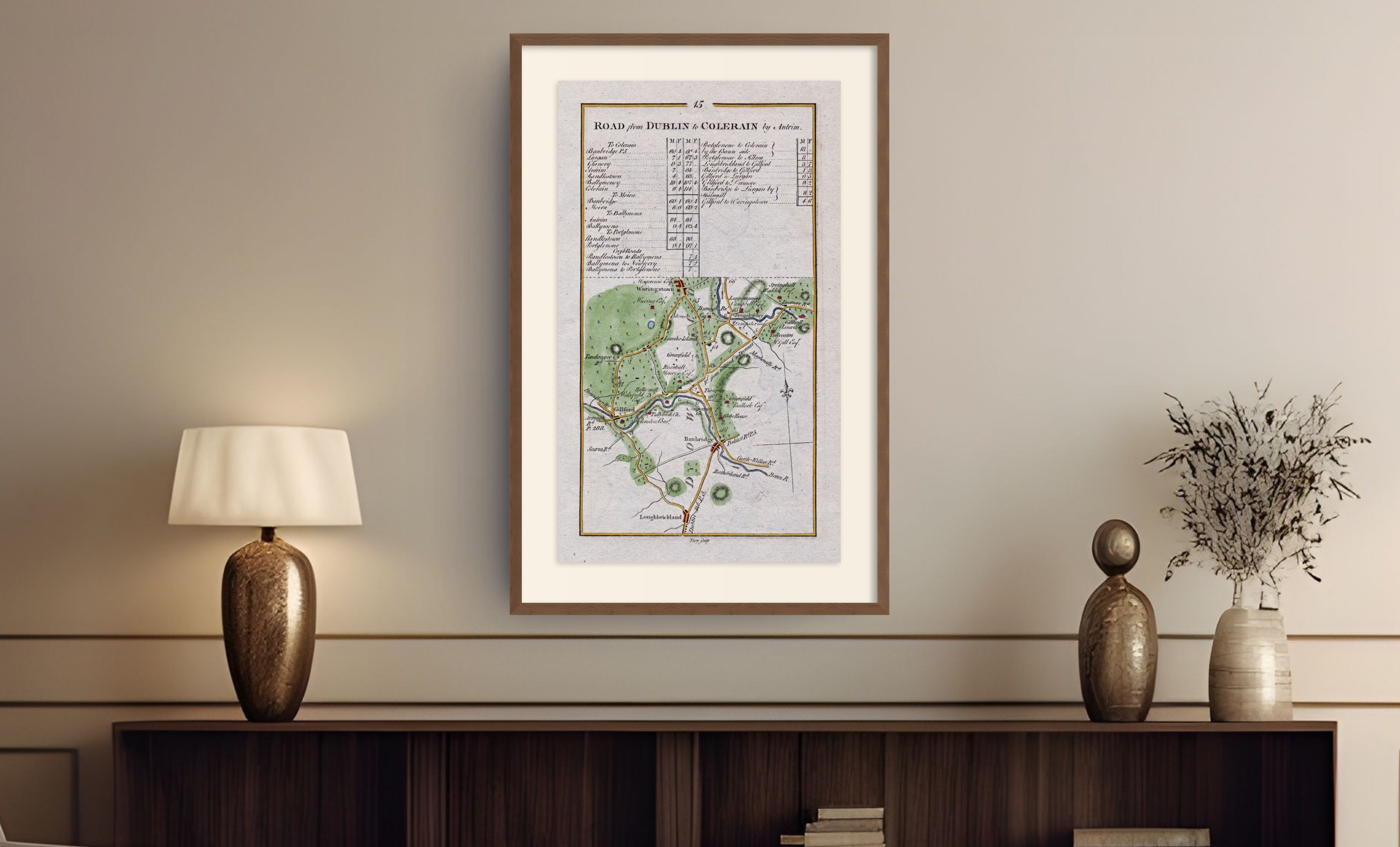 Framed antique Ireland road map of Banbridge, Gilford, Waringstown and Loughbrickland displayed in a styled room interior.