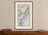 Framed 1783 Taylor & Skinner Belfast, Carrickfergus, Ballynure, Whiteabbey and Ballycarry, Ireland road map displayed above an antique wooden cabinet.