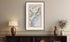 Framed antique Ireland road map of Belfast, Carrickfergus, Ballynure, Whiteabbey and Ballycarry displayed in a styled room interior.