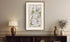 Framed antique Ireland road map of Belfast, Lisburn, Banbridge and Hillsborough displayed in a styled room interior.
