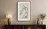 Framed antique Ireland road map of Downpatrick, Strangford, Portaferry and Killough displayed in a styled room interior.