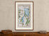 Framed 1783 Taylor & Skinner Ireland road map showing Dundalk, Carlingford, Newry, Warrenpoint and Rostrevor, displayed above an antique wooden cabinet.