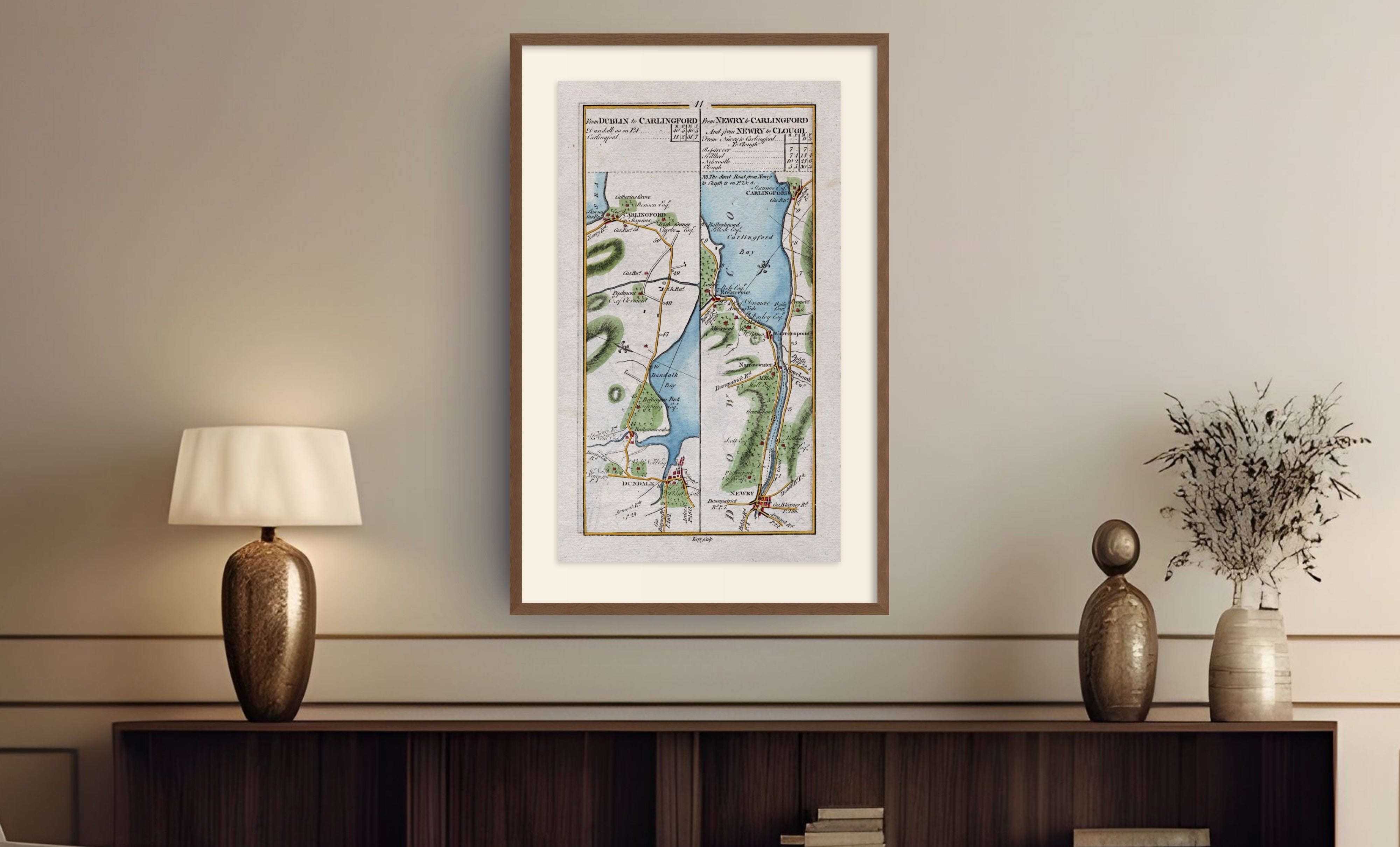 Framed antique Ireland road map of Dundalk, Carlingford, Newry, Warrenpoint and Rostrevor displayed in a styled room interior.