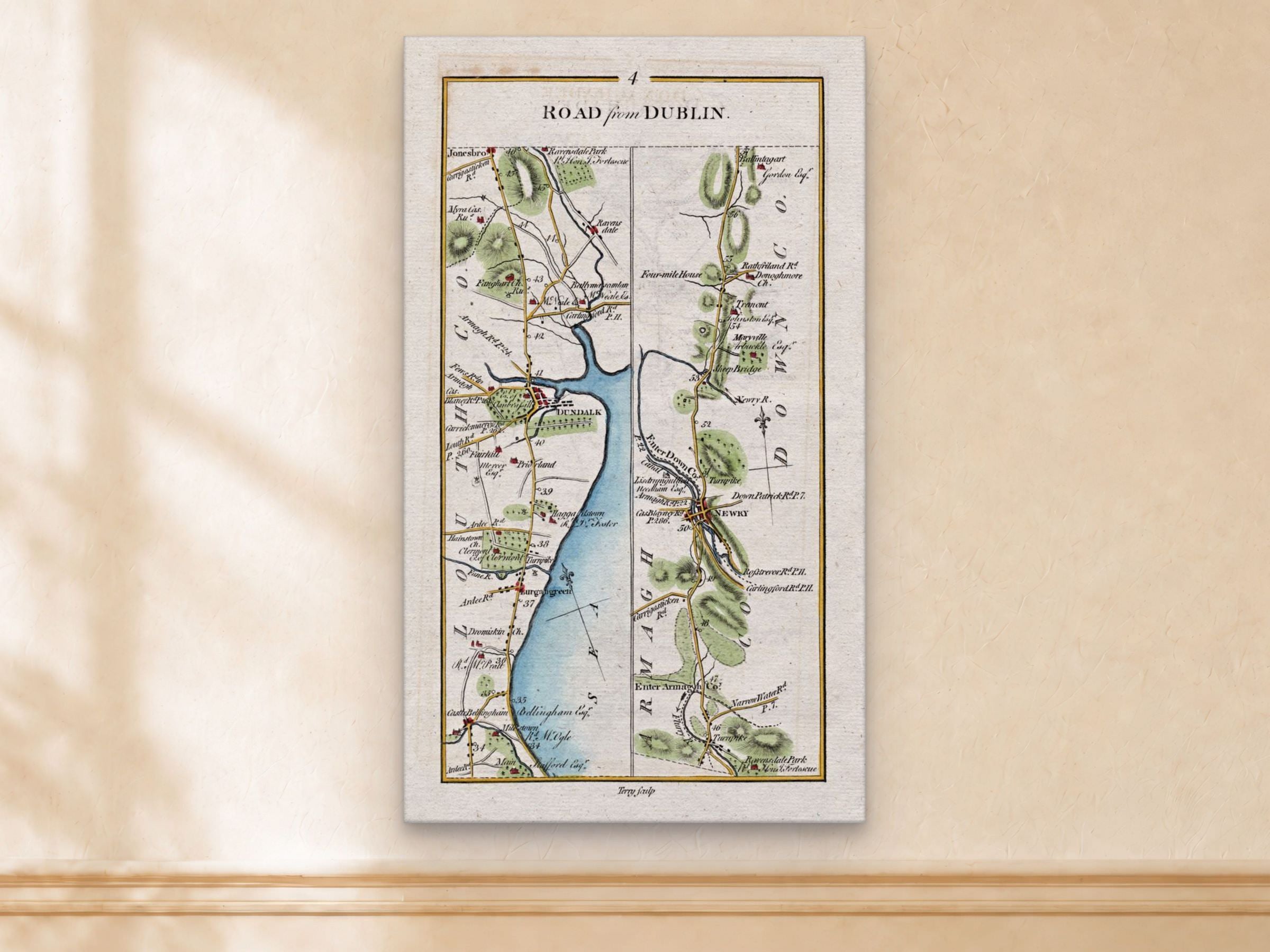 1783 Taylor & Skinner Dundalk, Newry, Castlebellingham and Dromiskin Ireland road map displayed on a light cream wall.