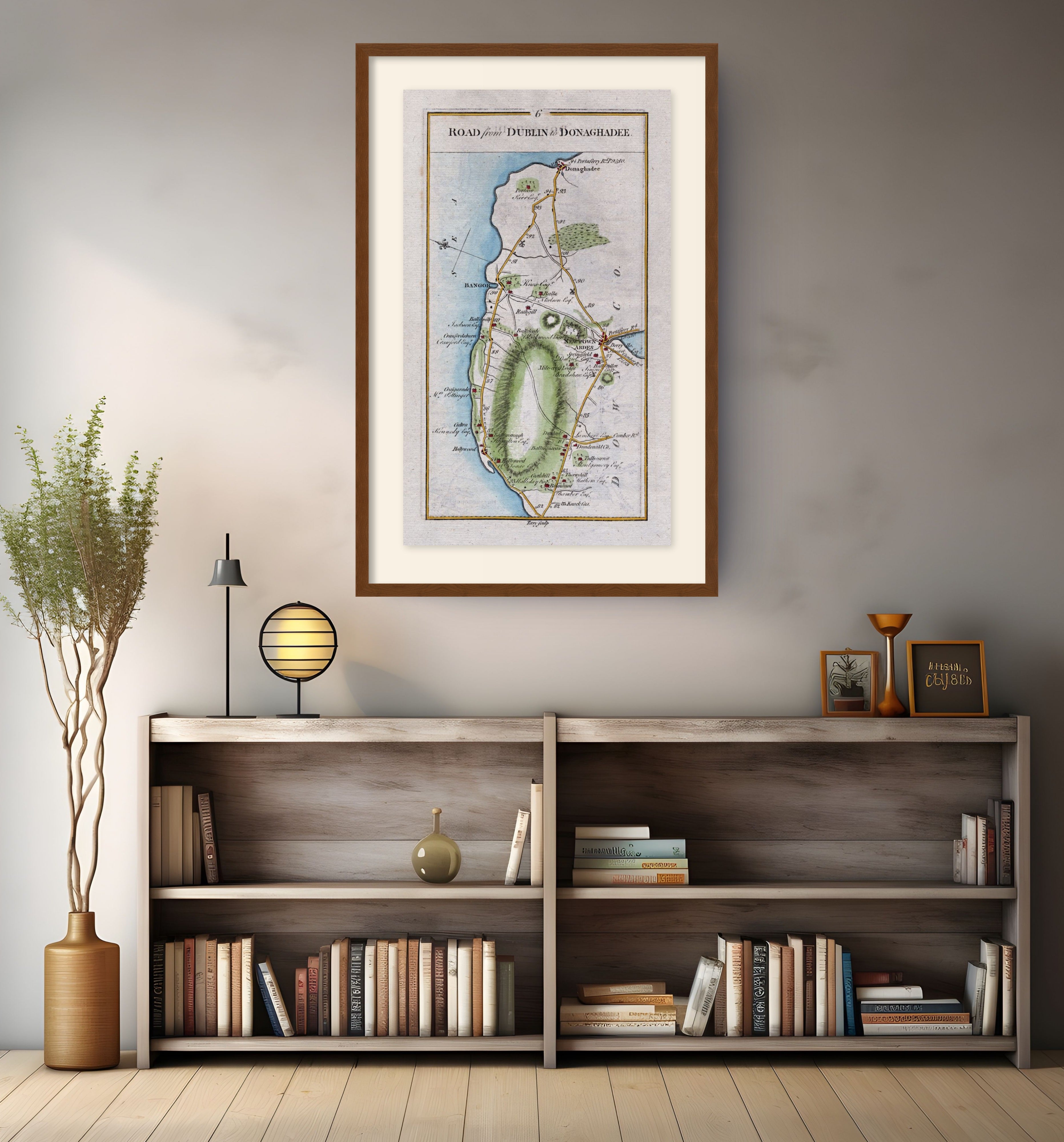 Framed antique Ireland road map of Holywood, Bangor, Newtownards and Donaghadee displayed in a modern interior.