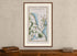 Framed 1783 Taylor & Skinner Kilkeel, Newcastle, Dundrum, Annalong and Clough, Ireland road map displayed above an antique wooden cabinet.