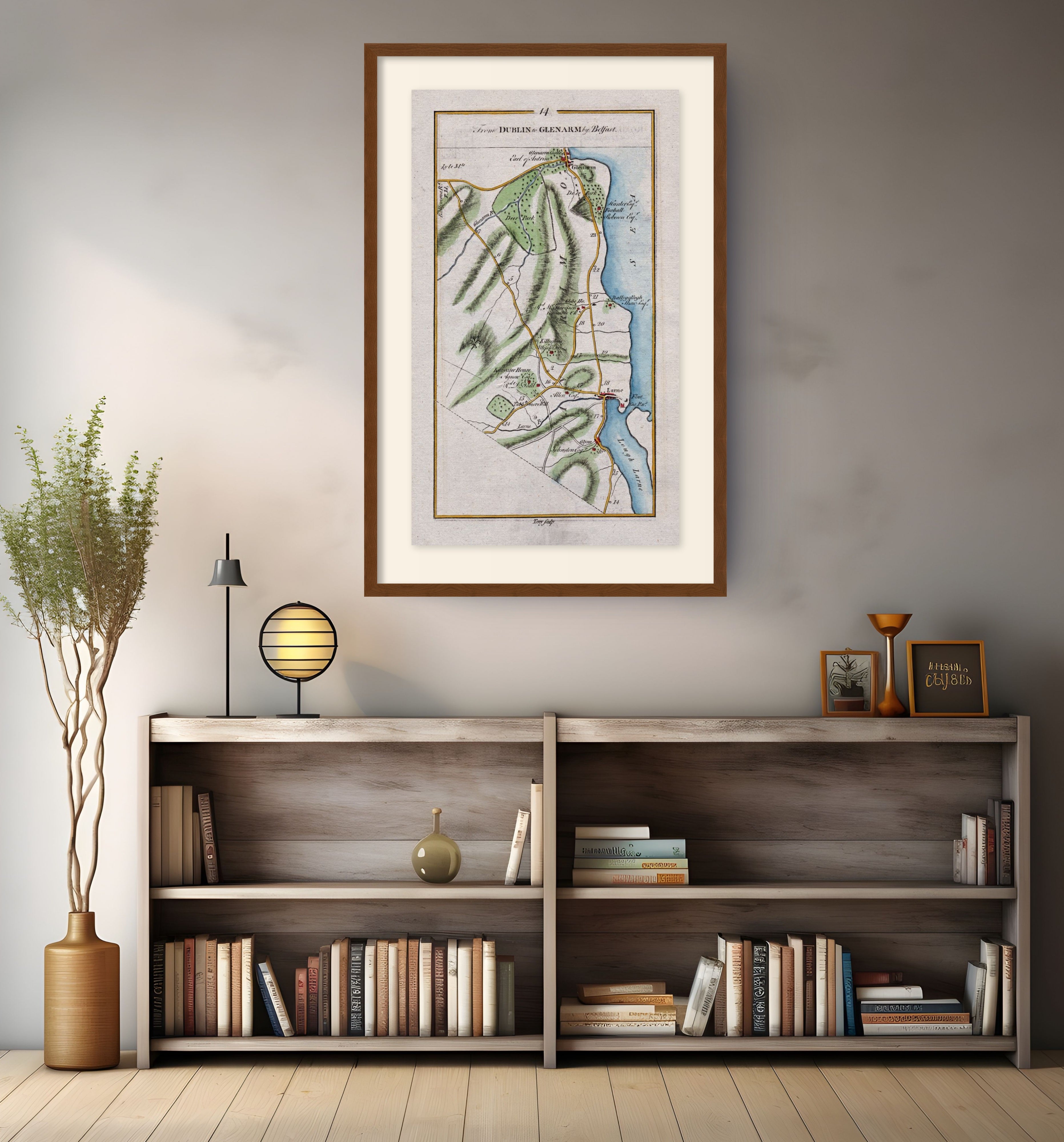 Framed antique Ireland road map of Larne, Glenarm, Ballygally and Glynn displayed in a modern interior.