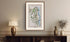 Framed antique Ireland road map of Larne, Glenarm, Ballygally and Glynn displayed in a styled room interior.