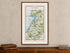 Framed 1783 Taylor & Skinner Lurgan, Moira, Crumlin, Glenavy and Ballinderry, Ireland road map displayed above an antique wooden cabinet.
