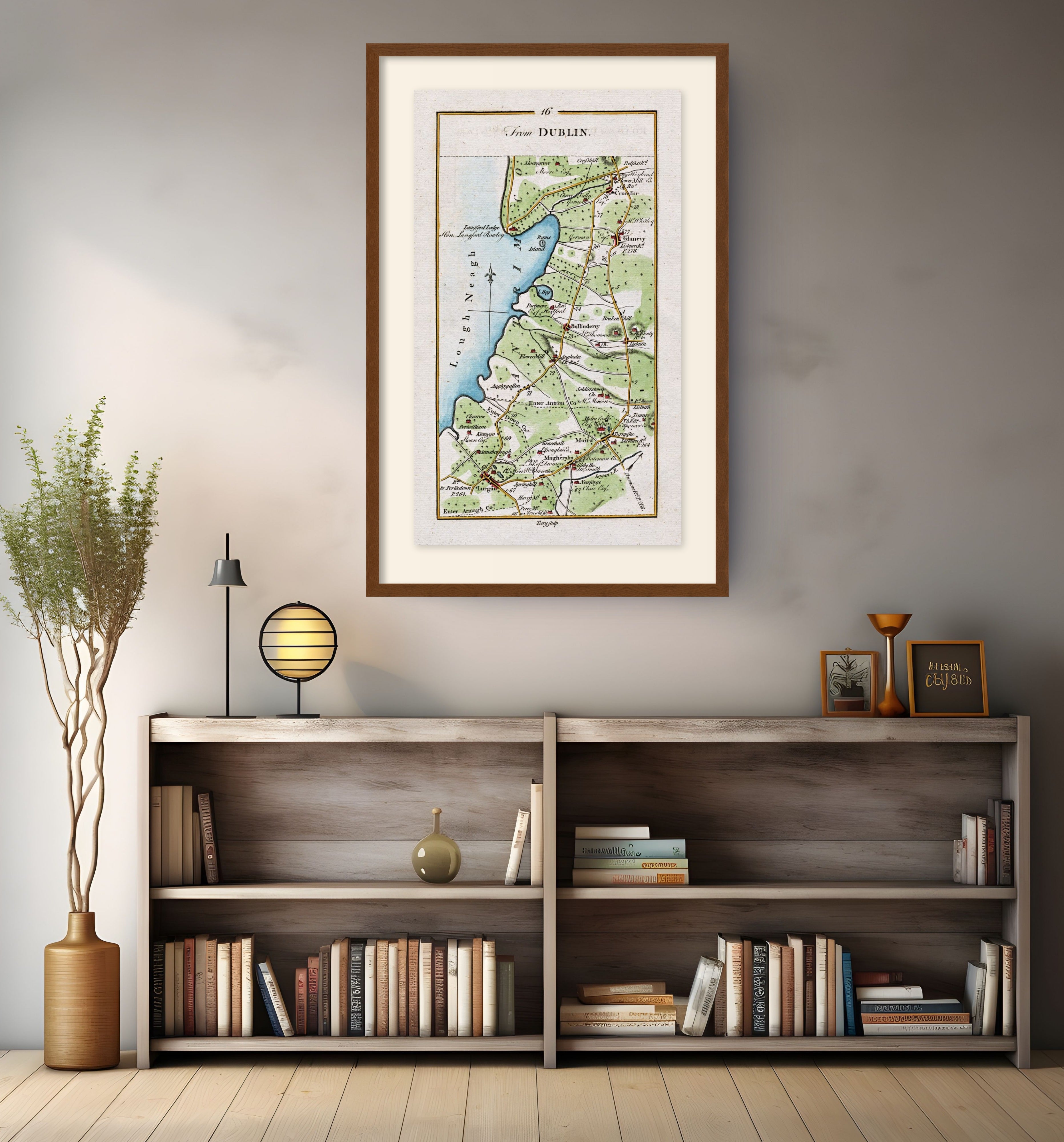 Framed antique Ireland road map of Lurgan, Moira, Crumlin, Glenavy and Ballinderry displayed in a modern interior.