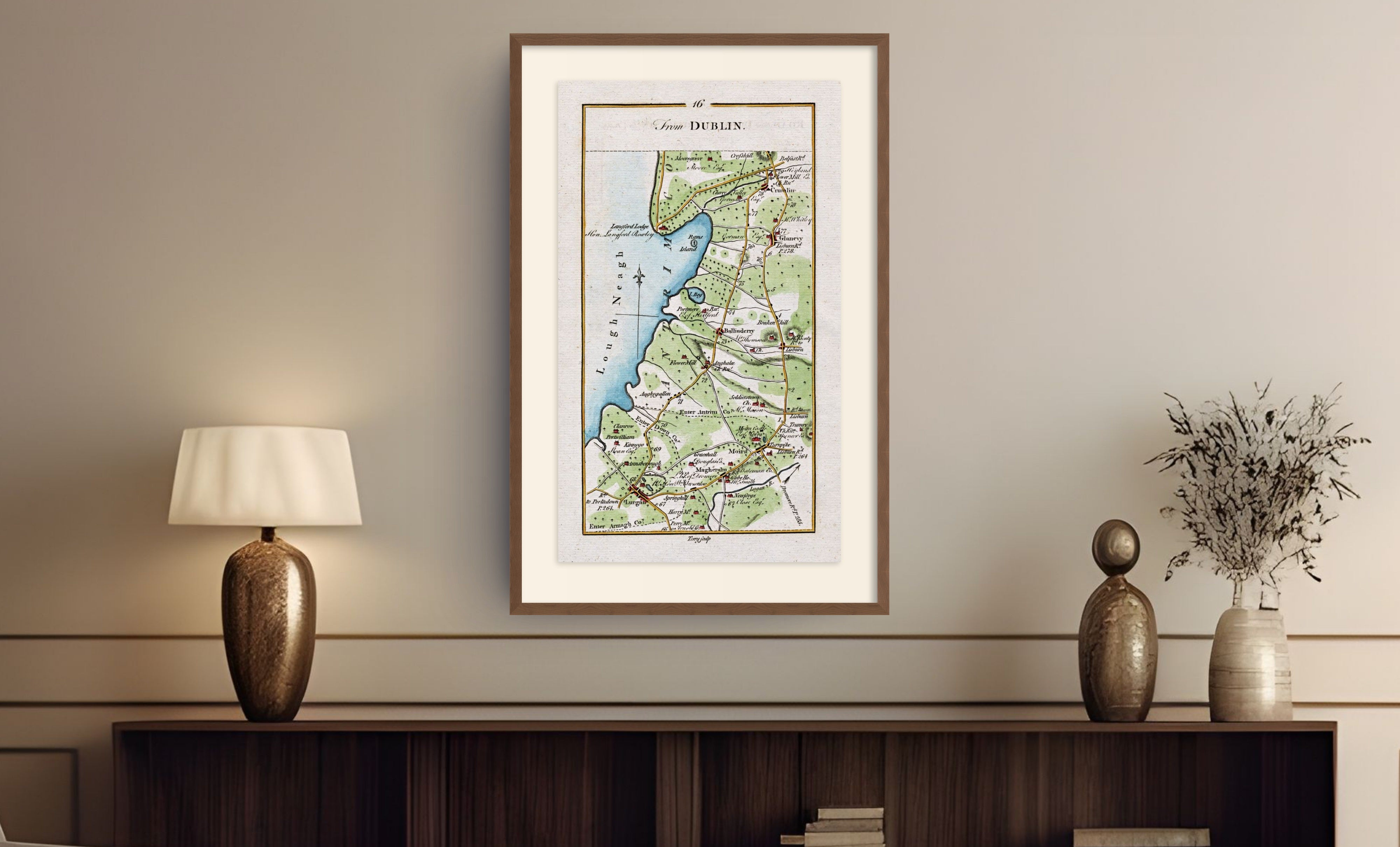 Framed antique Ireland road map of Lurgan, Moira, Crumlin, Glenavy and Ballinderry displayed in a styled room interior.