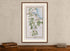 Framed 1783 Taylor & Skinner Ireland road map showing Newcastle, Castlewellan, Dundrum and Clough, displayed above an antique wooden cabinet.