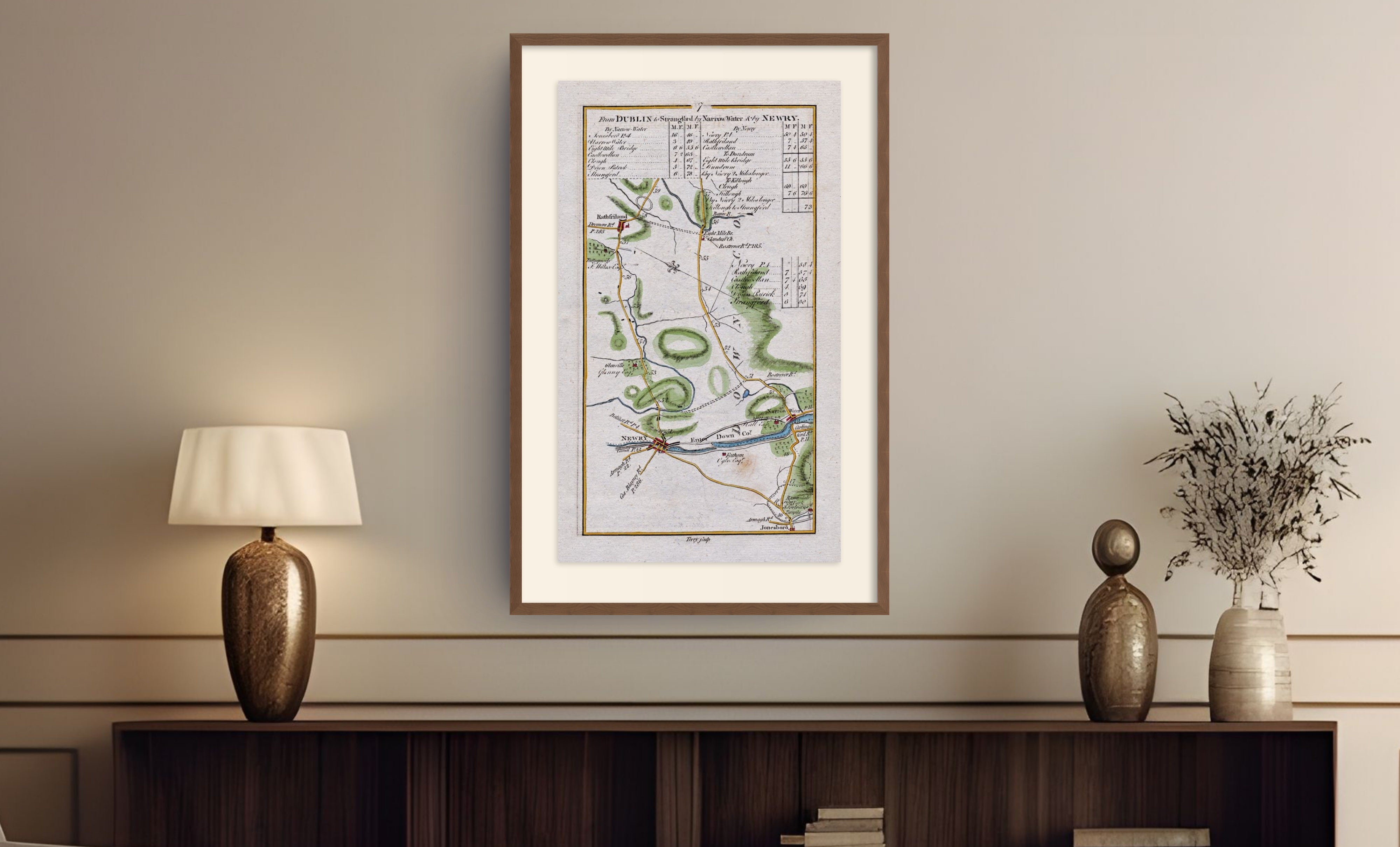 Framed antique Ireland road map of Newry, Rathfriland, Narrow Water and Jonesborough displayed in a styled room interior.