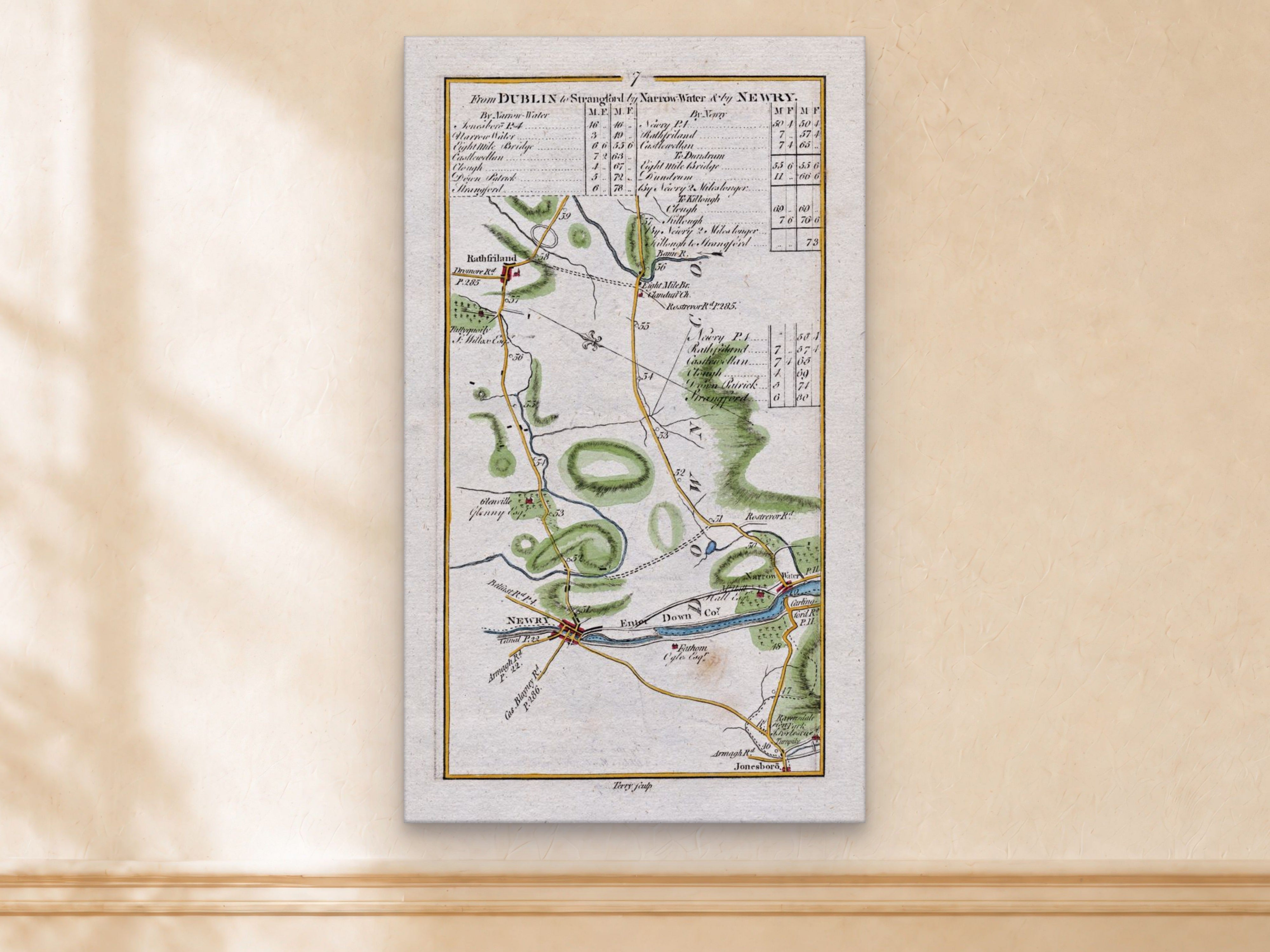 1783 Taylor & Skinner Newry, Rathfriland, Narrow Water and Jonesborough Ireland road map displayed on a light cream wall.