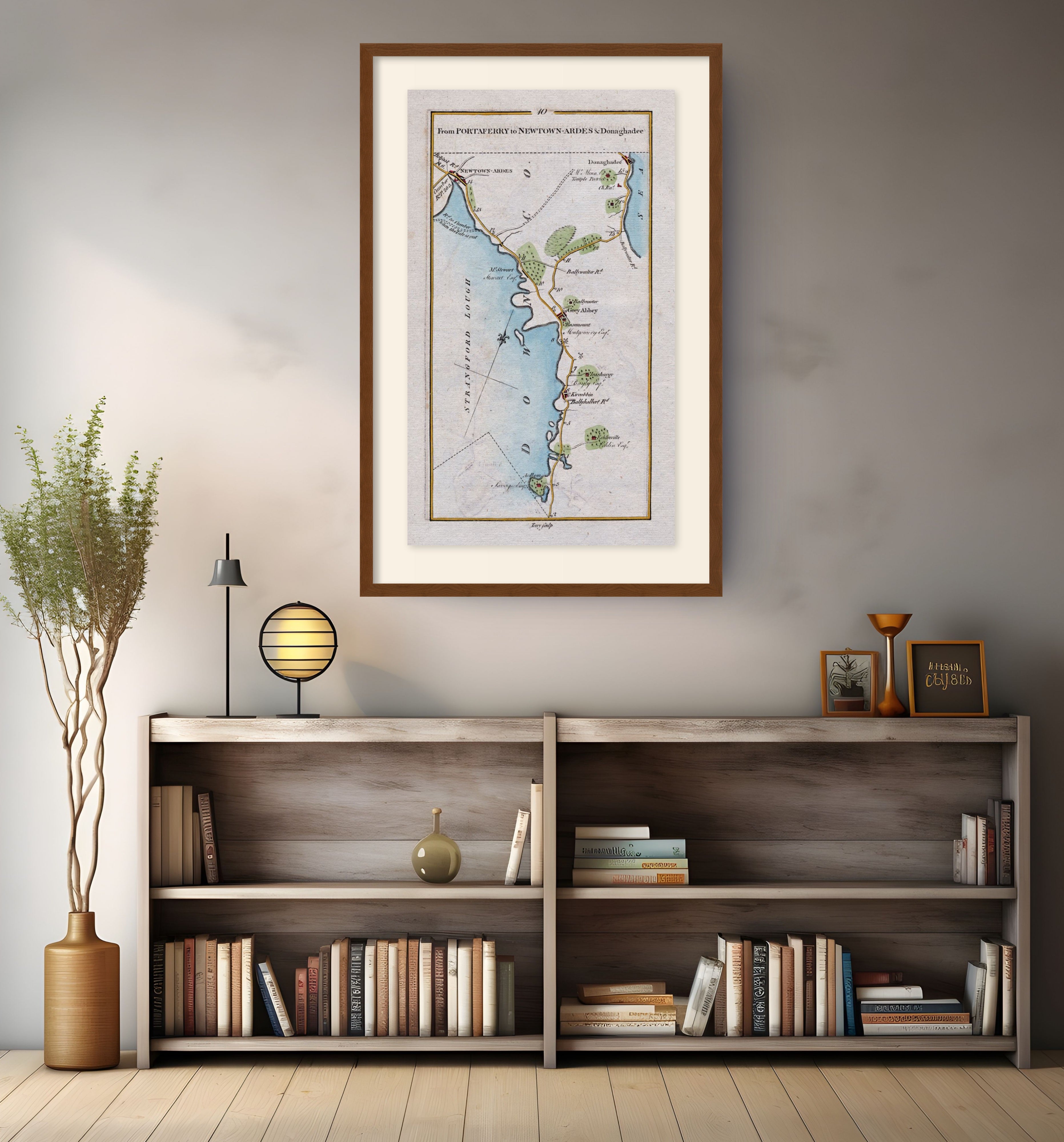 Framed antique Ireland road map of Newtownards, Donaghadee, Greyabbey and Kircubbin displayed in a modern interior.