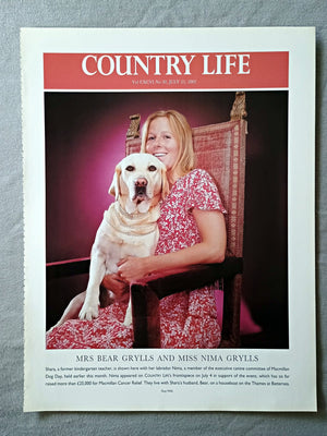 Mrs Bear Grylls and Miss Nima Grylls - Shara, a former kindergarten teacher, is shown here with her labrador Nima, a member of the executive canine committee of Macmillan Dog Day, held earlier this month. Nima appeared on COUNTRY LIFE's frontispiece on July 4 in support of the event, which has so far raised more than £25,000 for Macmillan Cancer Relief. They live with Shara's husband, Bear, on a houseboat on the Thames at Battersea