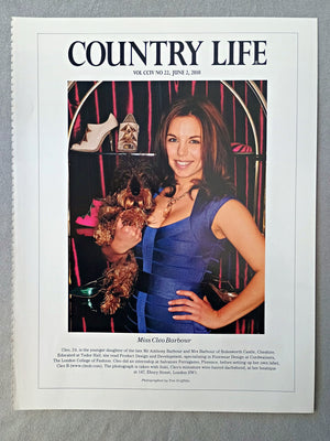 Miss Cleo Barbour - Cleo, 24, is the younger daughter of the late Mr Anthony Barbour and Mrs Barbour of Bolesworth Castle, Cheshire. Educated at Tudor Hall, she read Product Design and Development, specialising in Footwear Design at Cordwainers, The London College of Fashion. Cleo did an internship at Salvatore Ferragamo, Florence, before setting up her own label, Cleo B. The photograph is taken with Suki, Cleo's miniature wire-haired dachshund, at her boutique at 147, Ebury Street, London SW1.
