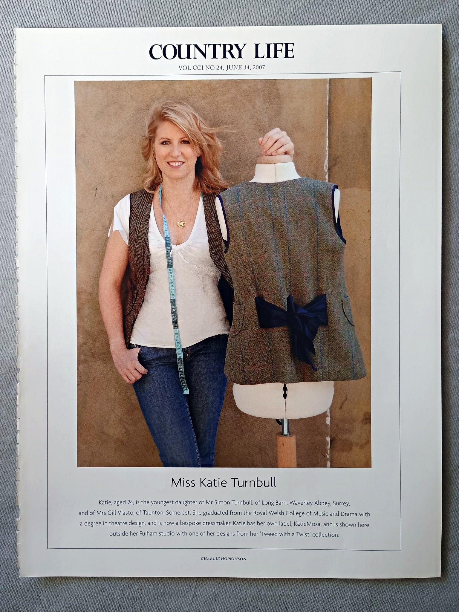 Miss Katie Turnbull - Katie, aged 24, is the youngest daughter of Mr Simon Turnbull, of Long Barn, Waverley Abbey, Surrey, and of Mrs Gill Vlasto, of Taunton, Somerset. She graduated from the Royal Welsh College of Music and Drama with a degree in theatre design, and is now a bespoke dressmaker. Katie has her own label, KatieMosa, and is shown here outside her Fulham studio with one of her designs from her 'Tweed with a Twist' collection.