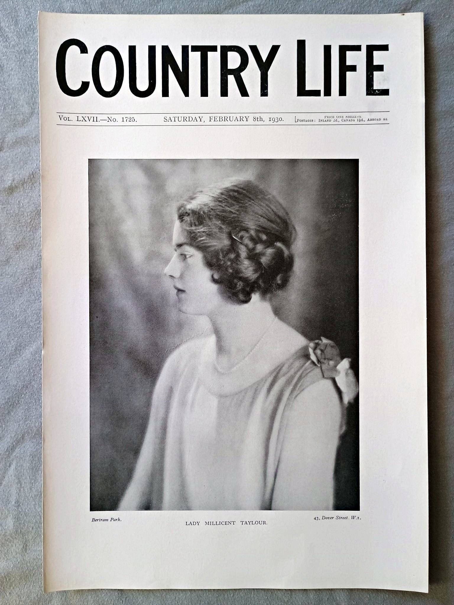 Lady Millicent Taylour Country Life Magazine Portrait, Frontispiece, February 8 1930. LXVII No. 1725

The frontispiece this week is a portrait of Lady Millicent Taylour, only daughter of the Marquess and Marchioness of Headfort, whose engagement to Mr. Henry Frederic Tiarks, eldest son of Mr. and Mrs. F. C. Tiarks, has recently been announced.
