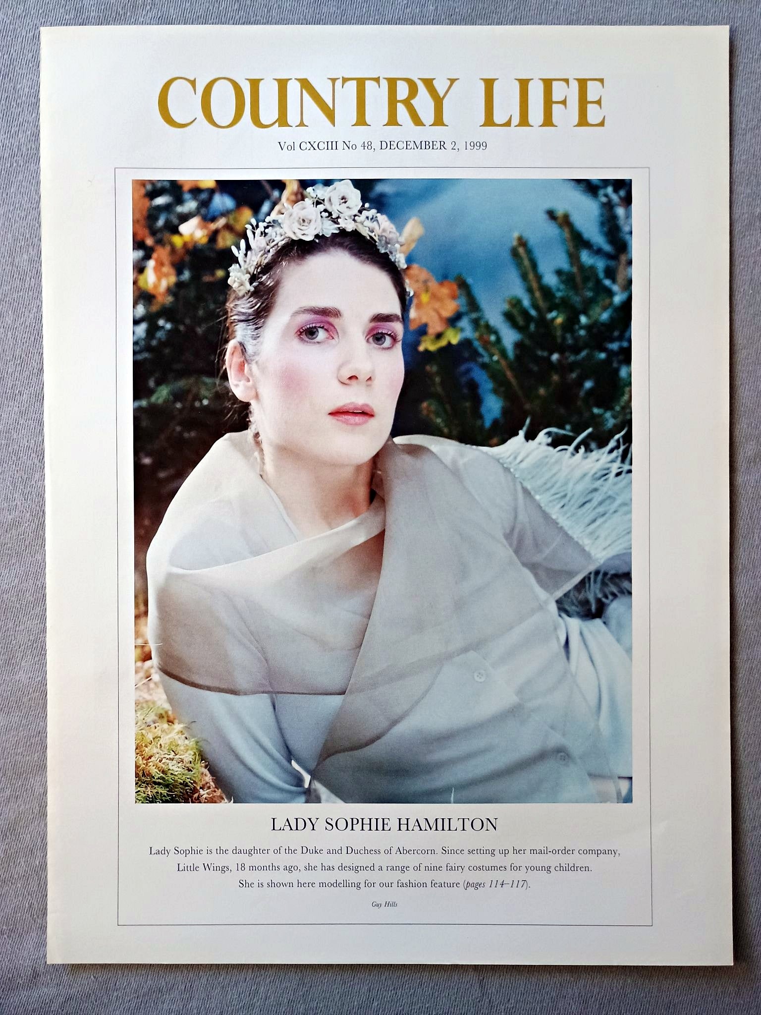 Lady Sophie Hamilton Country Life Magazine Portrait December 2 1999. CXCIII No. 48

Lady Sophie Hamilton is the daughter of the Duke and Duchess of Abercorn. Since setting up her mail-order company, Little Wings, 18 months ago, she has designed a range of nine fairy costumes for young children. She is shown here modelling for our fashion feature (pages 114-117.