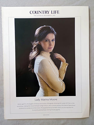 Lady Marina Moore - Marina, aged 19, is the daughter of the Earl and Countess of Drogheda, of Notting Hill, London W11. She is in her second year, studying the viola at the Royal College of Music, and is currently playing in the Valencia Opera House Orchestra for a production of Don Carlos. Photographed here by her father, Marina was the inspiration for his recently published book, Notting Hill