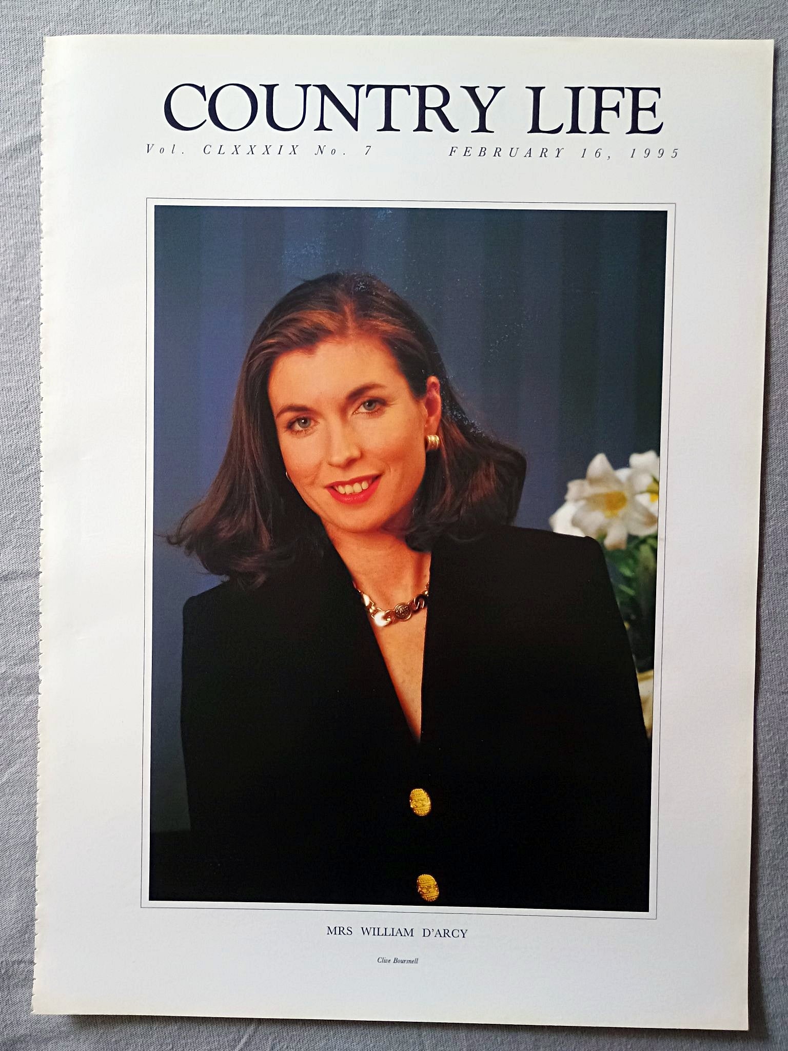 Mrs William D'Arcy Country Life Magazine Portrait February 16, 1995. CLXXXIX No. 7

This is an authentic original page from Country Life magazine, part of the iconic series often affectionately referred to as the “Girls in Pearls” portraits — elegant society images that captured a distinctive era of British publishing and portraiture