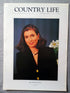 Mrs William D'Arcy Country Life Magazine Portrait February 16, 1995. CLXXXIX No. 7

This is an authentic original page from Country Life magazine, part of the iconic series often affectionately referred to as the “Girls in Pearls” portraits — elegant society images that captured a distinctive era of British publishing and portraiture