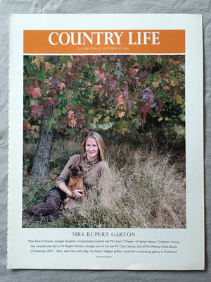 Mrs Rupert Garton - Miss Alice O'Dwyer, younger daughter of Lieutenant-Colonel and Mrs Sean O'Dwyer, of Harlyn House, Chobham, Surrey, was recently married to Mr Rupert Garton, younger son of the late Mr Clive Garton, and of Mrs Michael Hicks Beach, of Battersea, SWII. Alice, seen here with Algy, the family's Belgian griffon, works for a marketing agency in Richmond.
