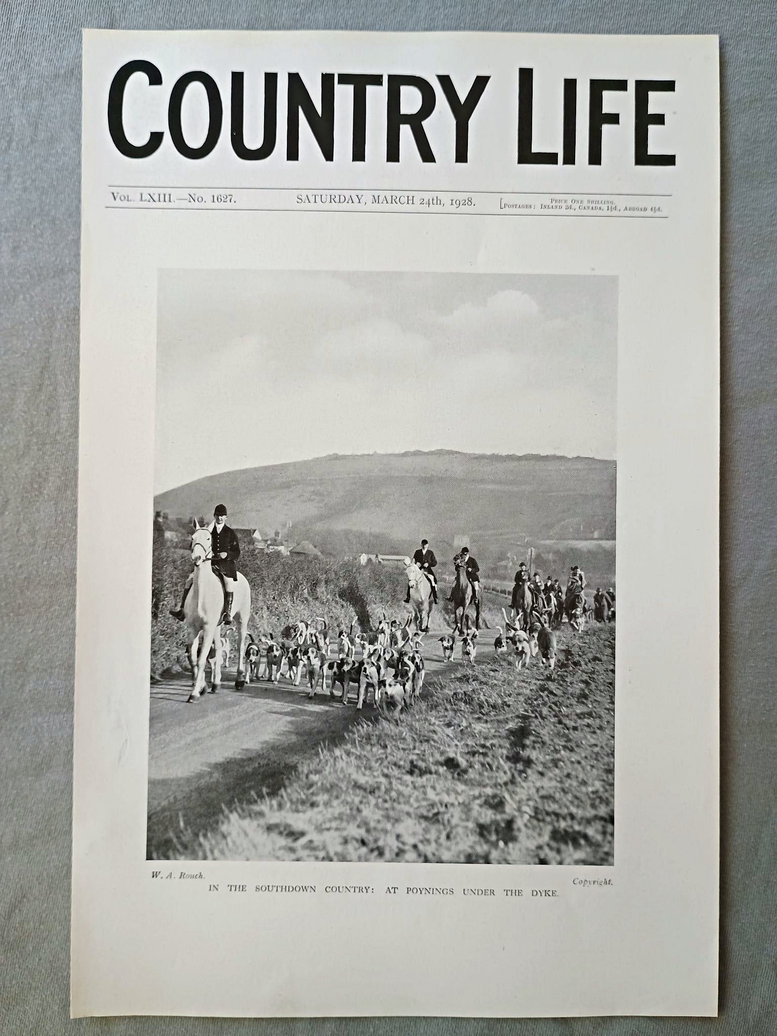 The Southdown Hunt at Poynings, Devil's Dyke Country Life Magazine Portrait, Frontispiece, March 24 1928. LXIII No. 1627

The featured frontispiece photograph, titled "In the Southdown Country: At Poynings under the Dyke," captures a hunting meet in the South Downs of West Sussex, England